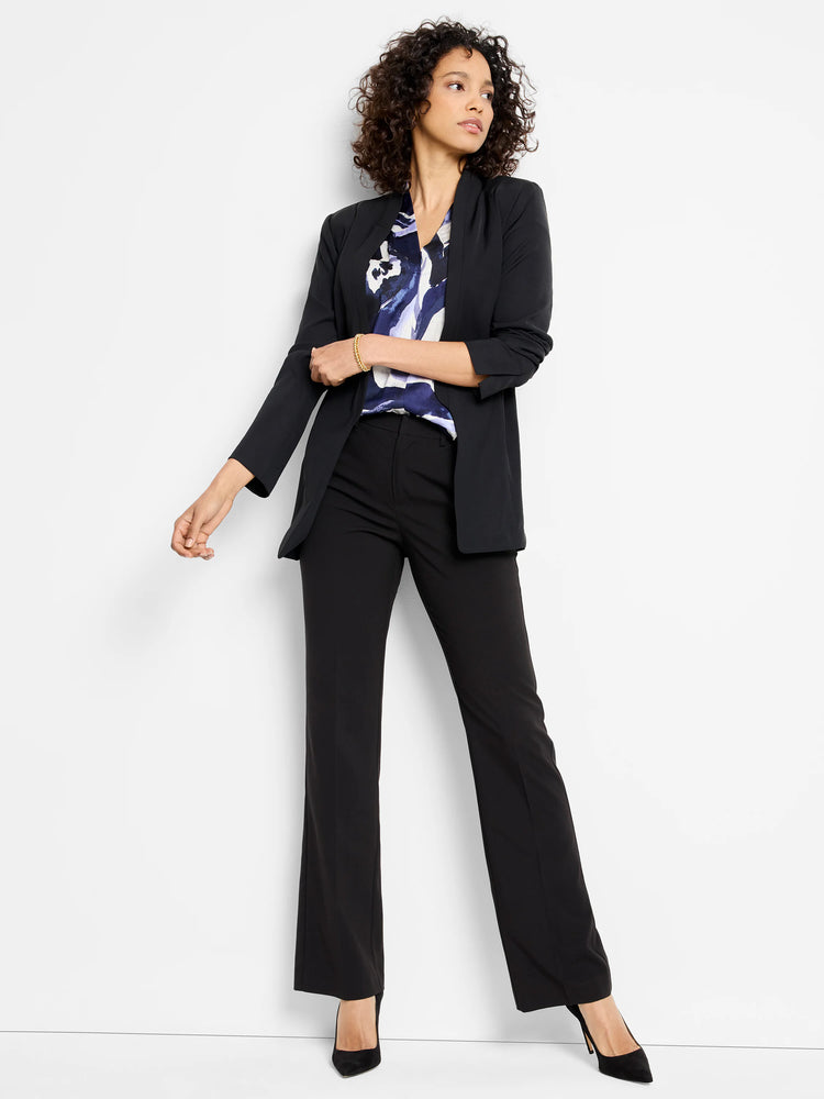 Black blazer, slightly flared black pants, and a blue, white, and purple abstract print blouse. Model is wearing black...