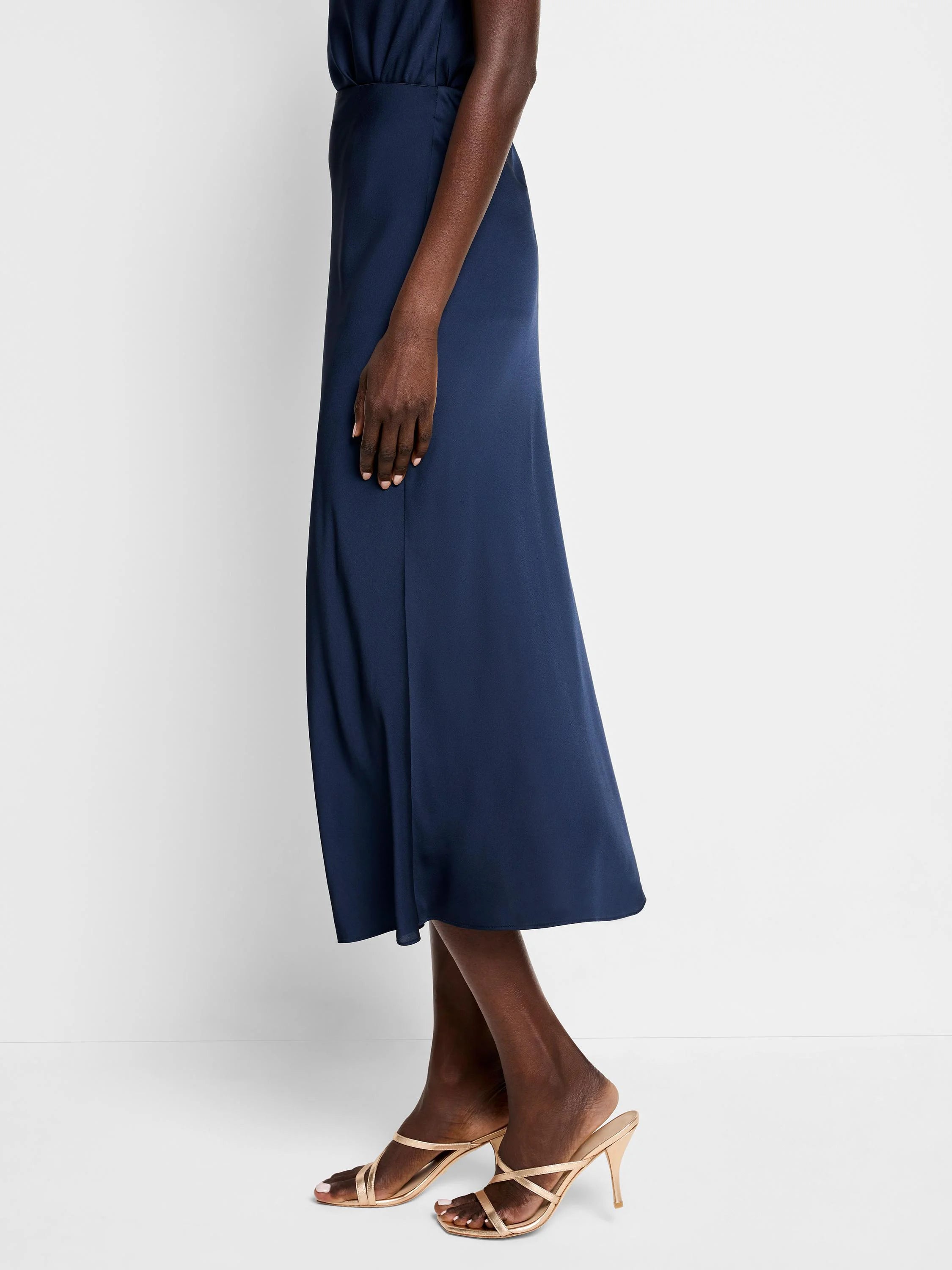 Navy blue midi slip skirt; A-line shape.