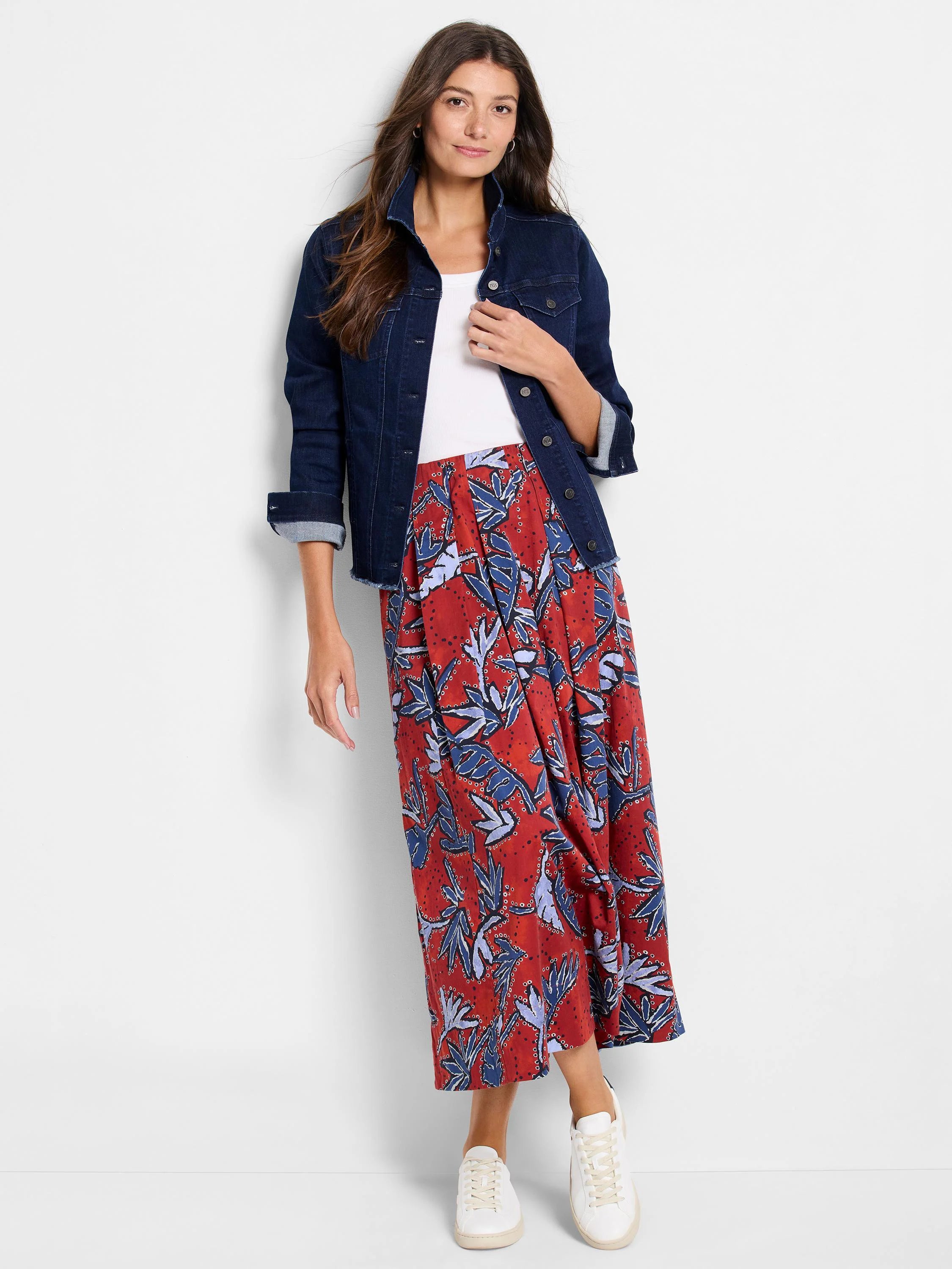 Red midi skirt with blue and white leaf print. Pleated.