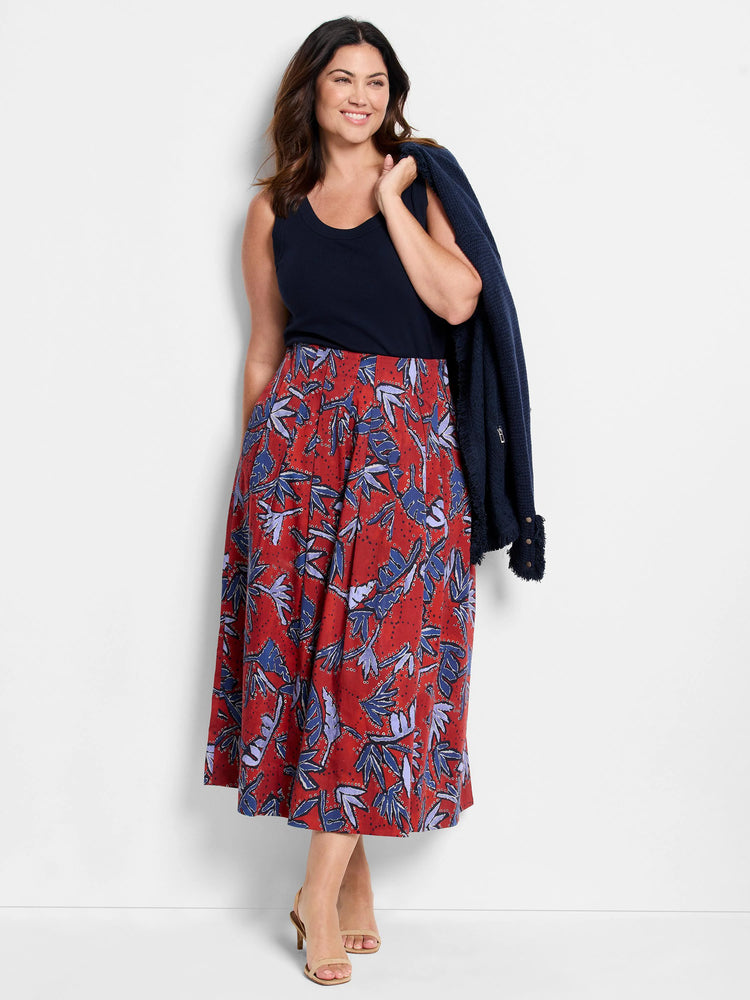 Midi skirt, red with blue and purple leaf print. A-line silhouette.