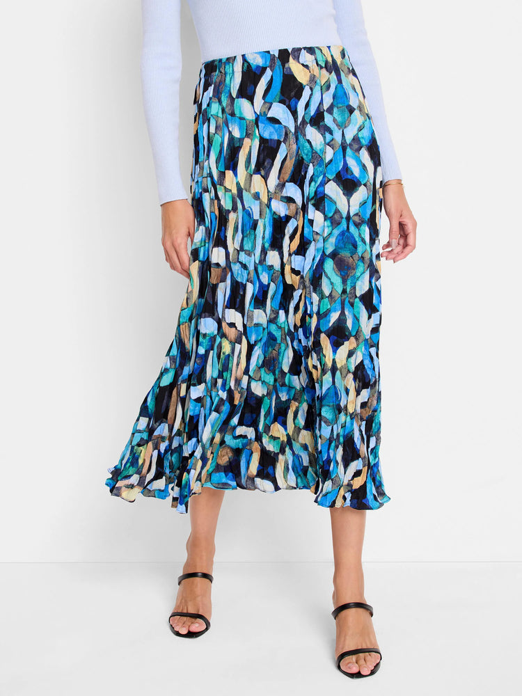 Mid-length pleated skirt in blues, greens, beige, and black abstract print. A-line silhouette.