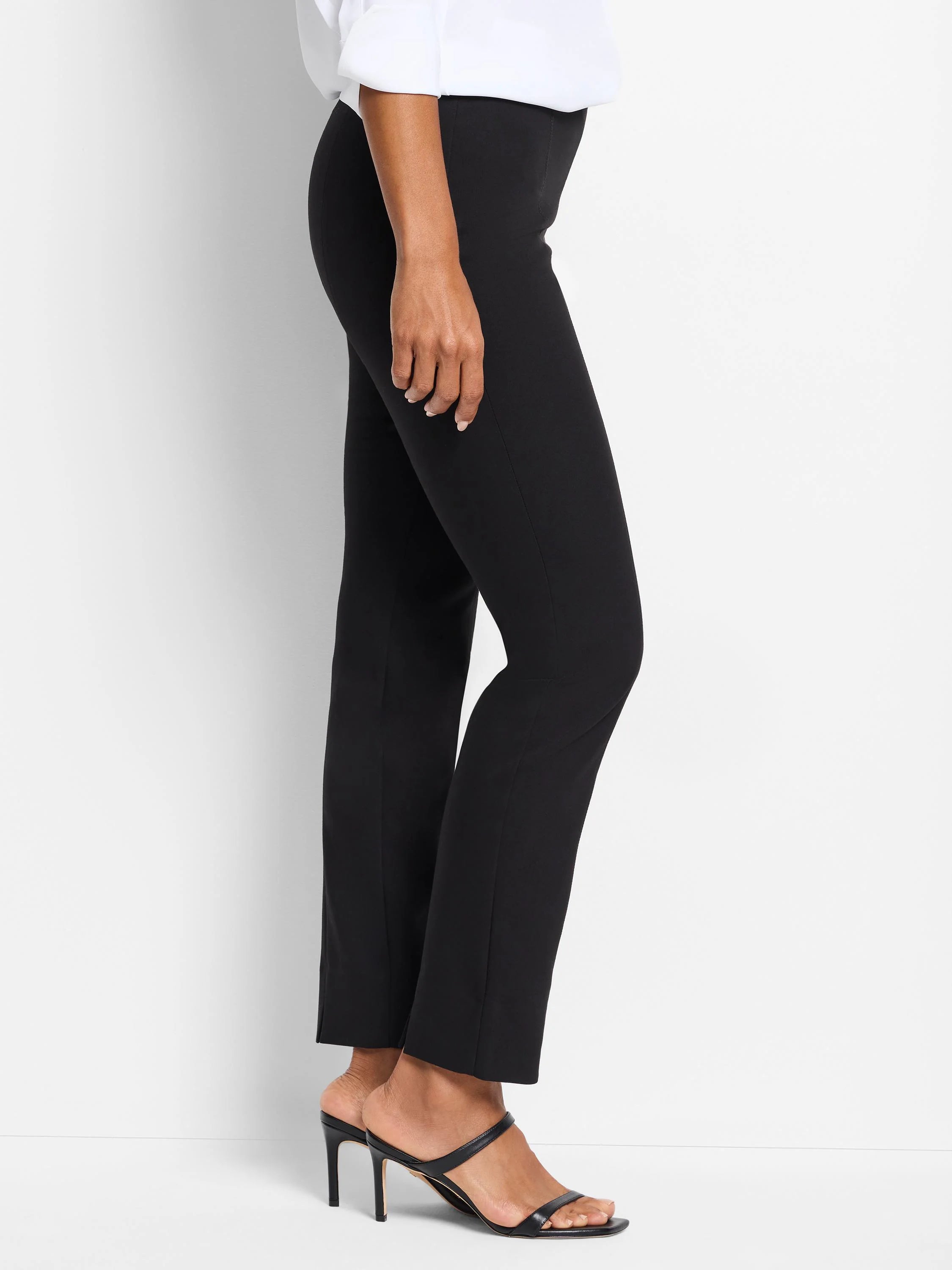 Black slim-leg pull-on pants shown on a model. Straight leg, mid-rise.