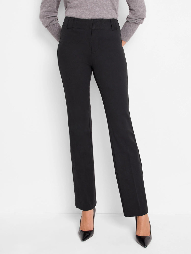 Black, straight-leg pants; mid-rise waist. Model is wearing black heels.