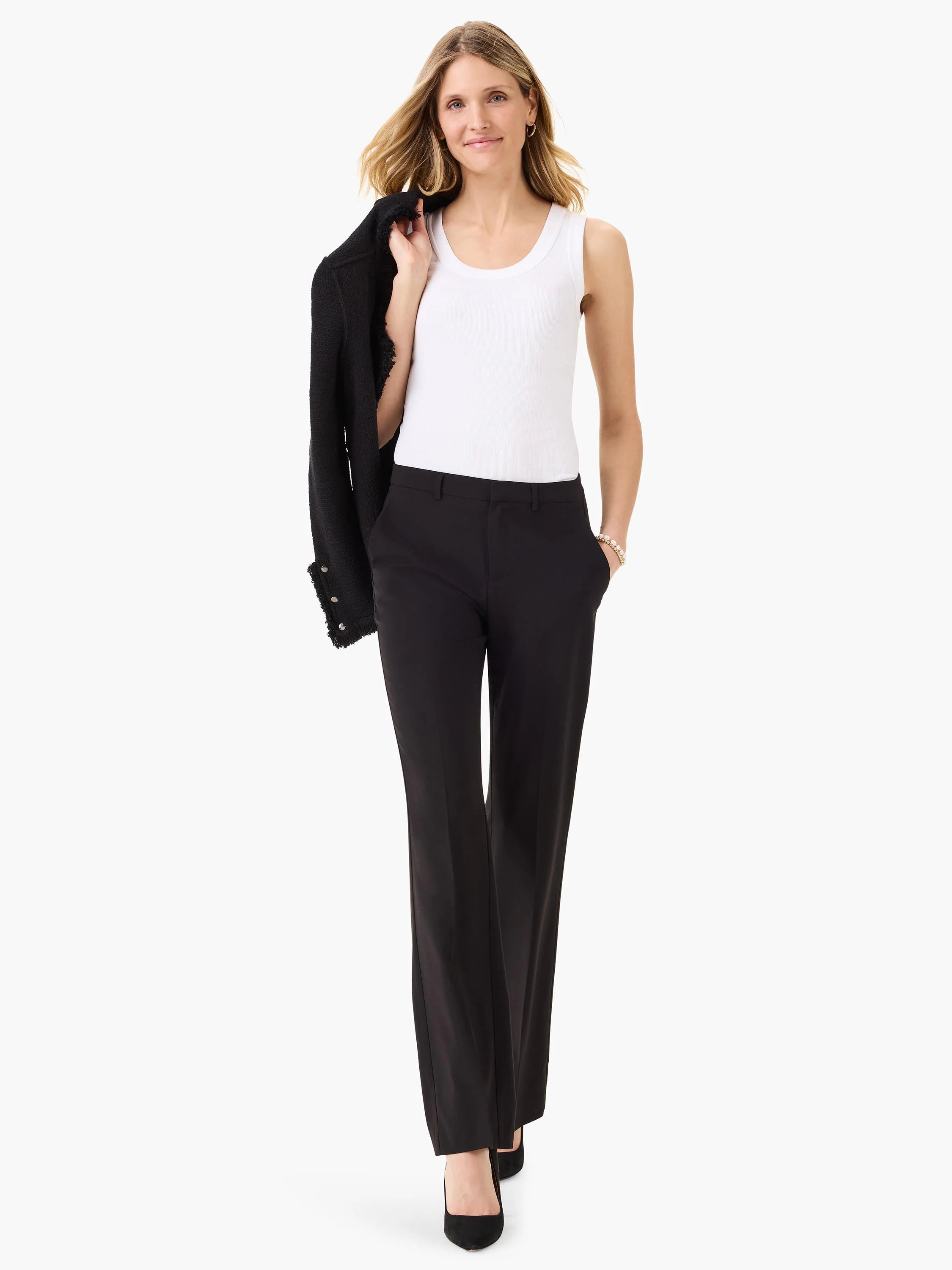 Black bootcut trousers on a model. The trousers are shown from a full-length perspective.