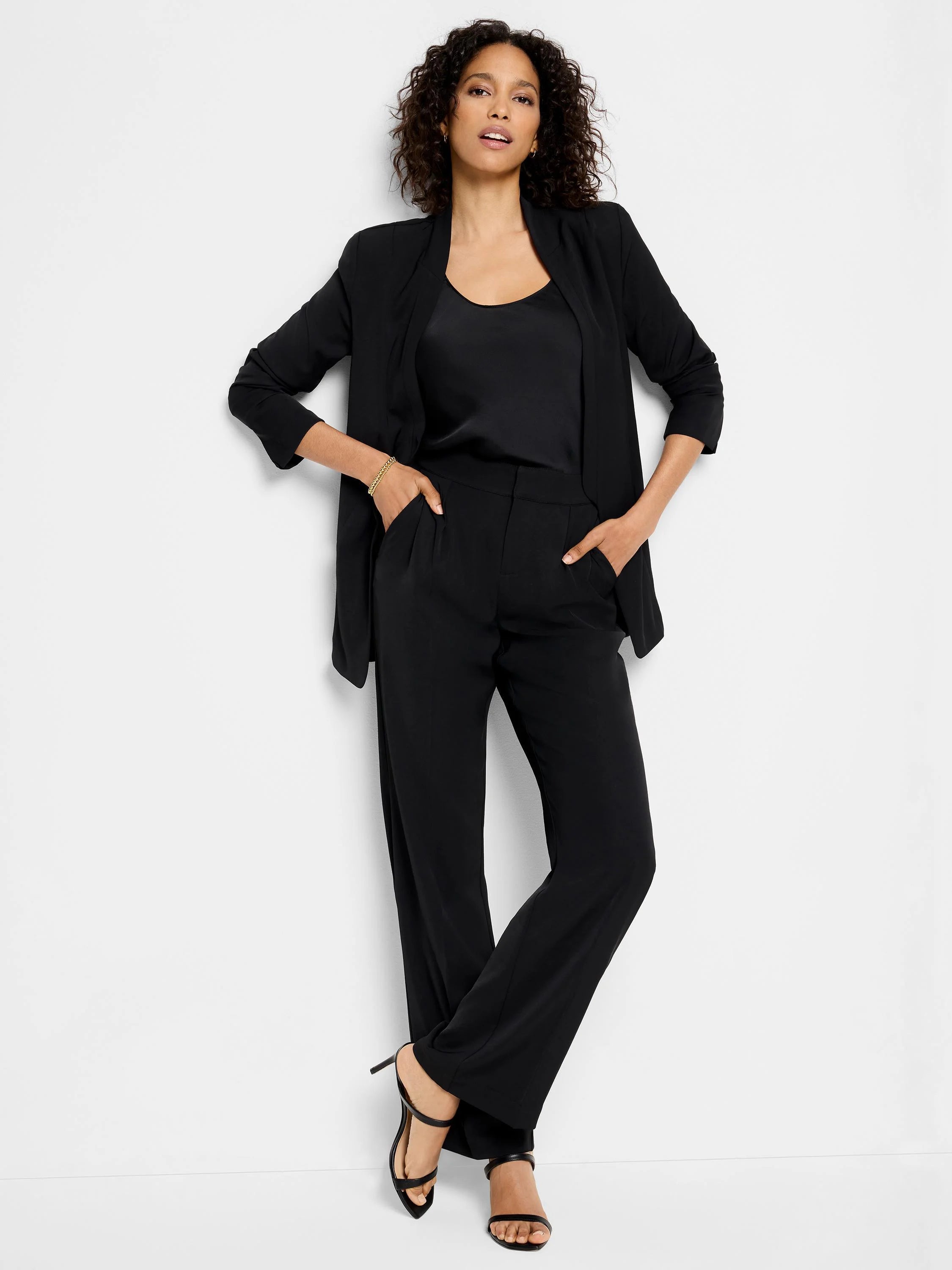 Black wide-leg trousers; shown on model.