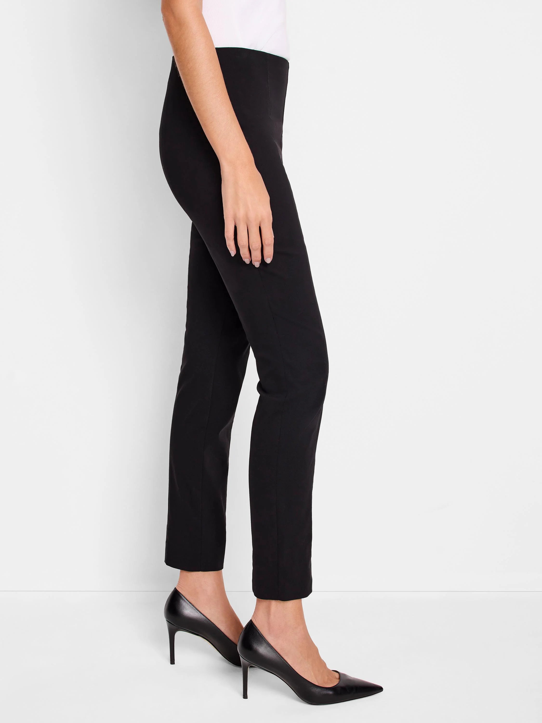 Black pull-on pants, slim fit, cropped length. Shown on model with black heels.