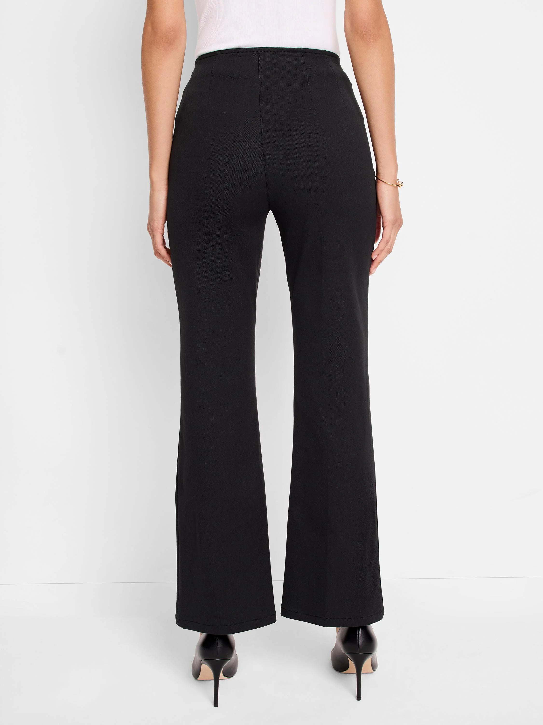 Black bootcut pull-on pants; rear view. Slight flare at hem.