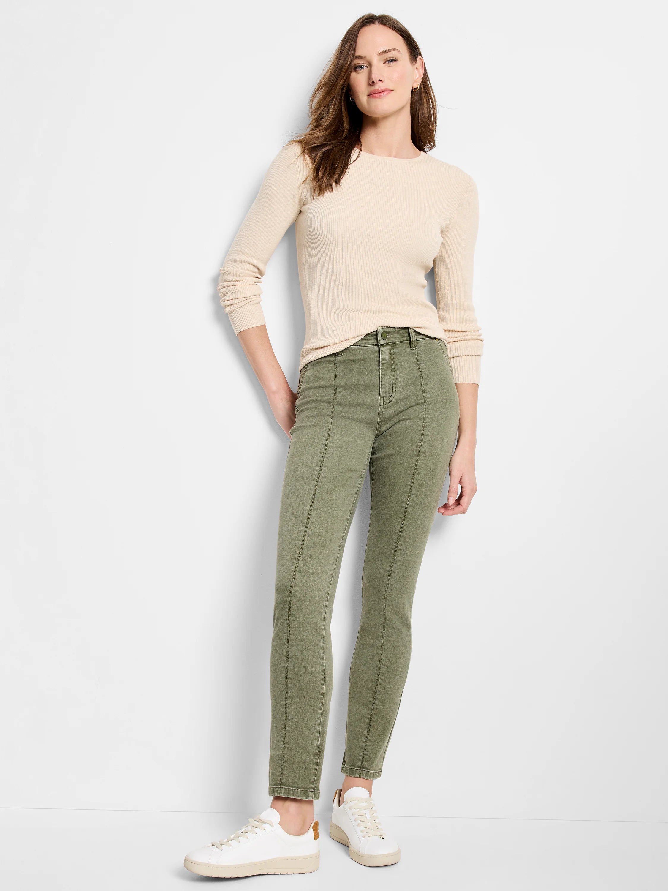Olive green straight carpenter jeans with visible front seams down each leg.