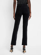 Black velvet ankle pants, straight leg.  Back view.