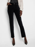 Black velvet ankle pants; straight leg; shown on model.