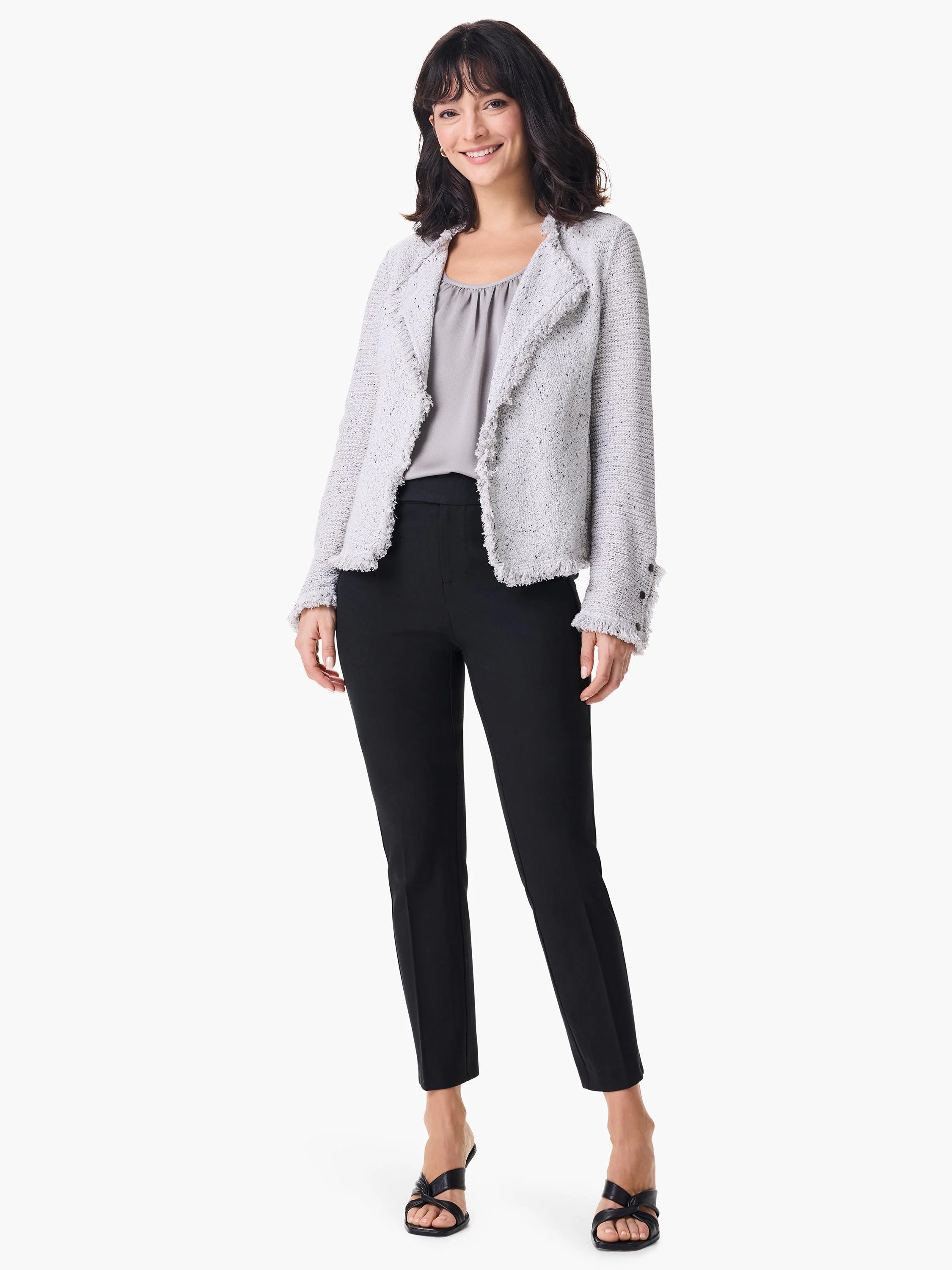 Black straight-leg pants on a model.  The pants are shown with a light gray tweed jacket and black shoes.