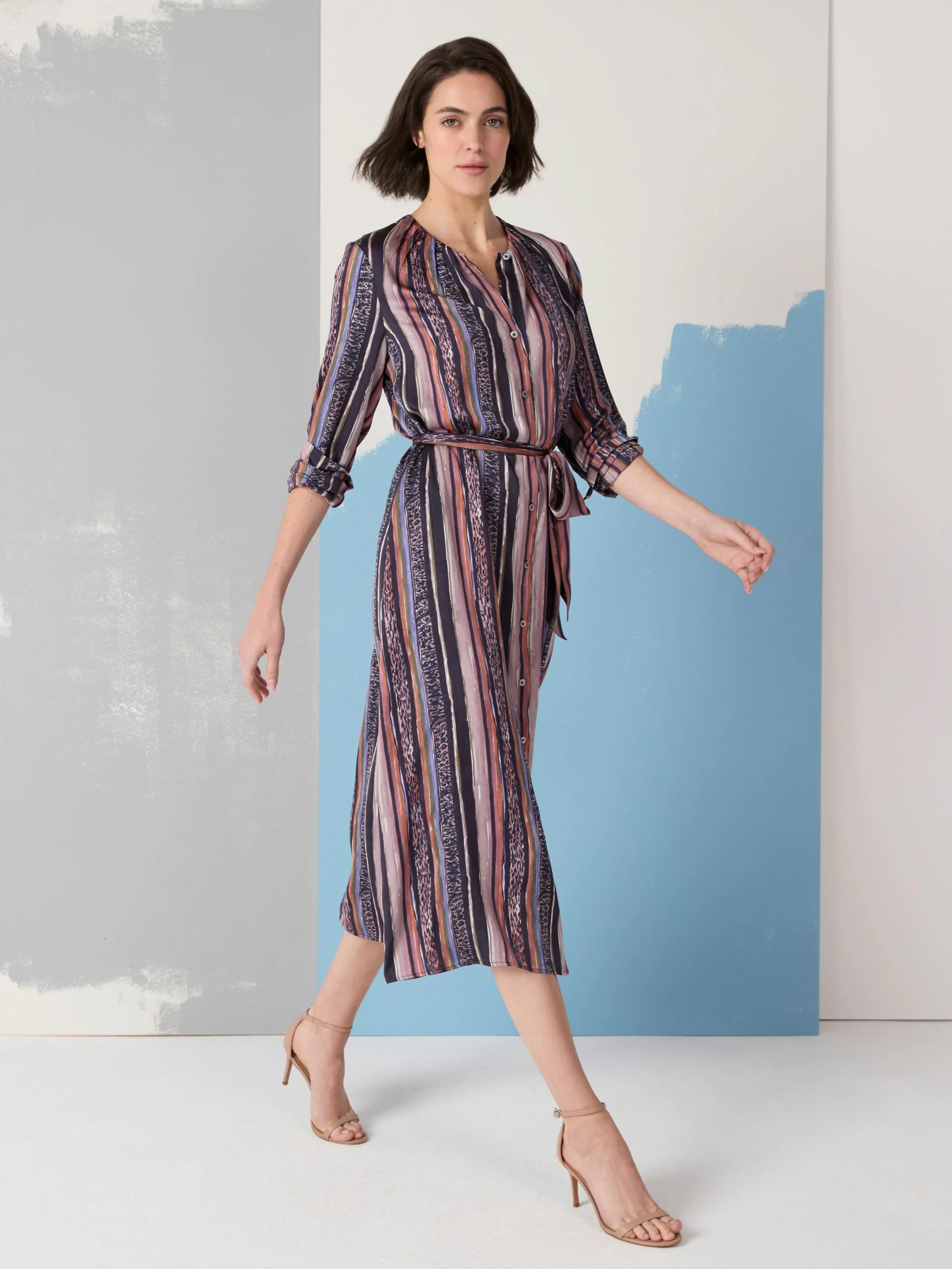 Midi-length shirt dress, purple, pink, orange, and blue vertical stripes and animal print details. Belted waist....