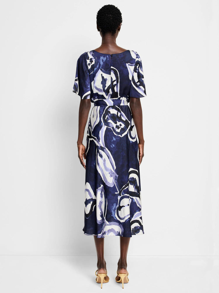 Mid-length dress, navy blue base with purple and white watercolor vine print. Short sleeves, belted waist.