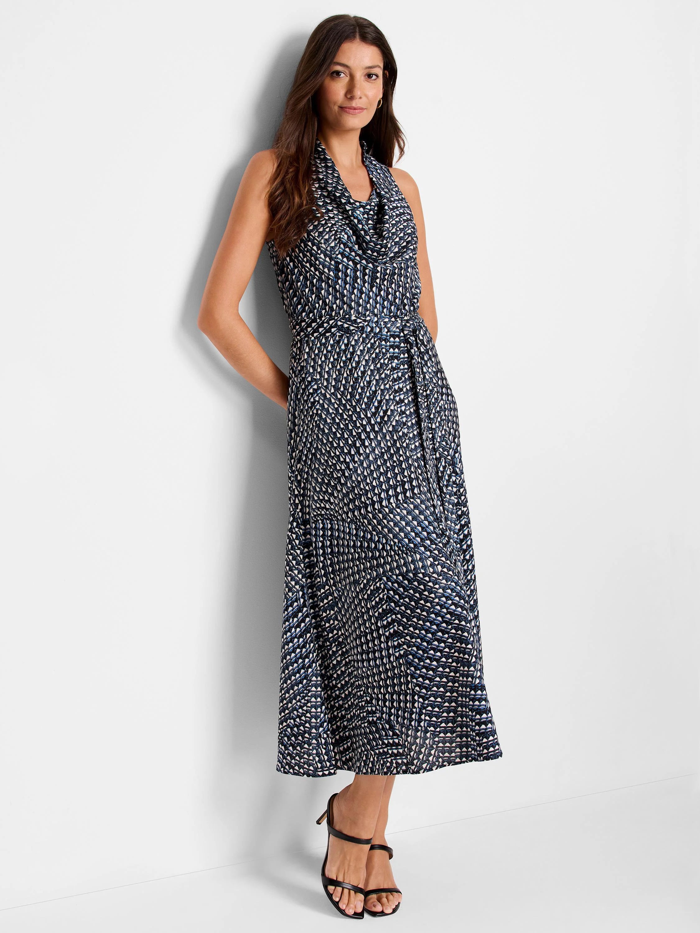 Maxi dress, cowl neck, sleeveless. Dark blue, white, and light blue geometric print. Self-tie belt.