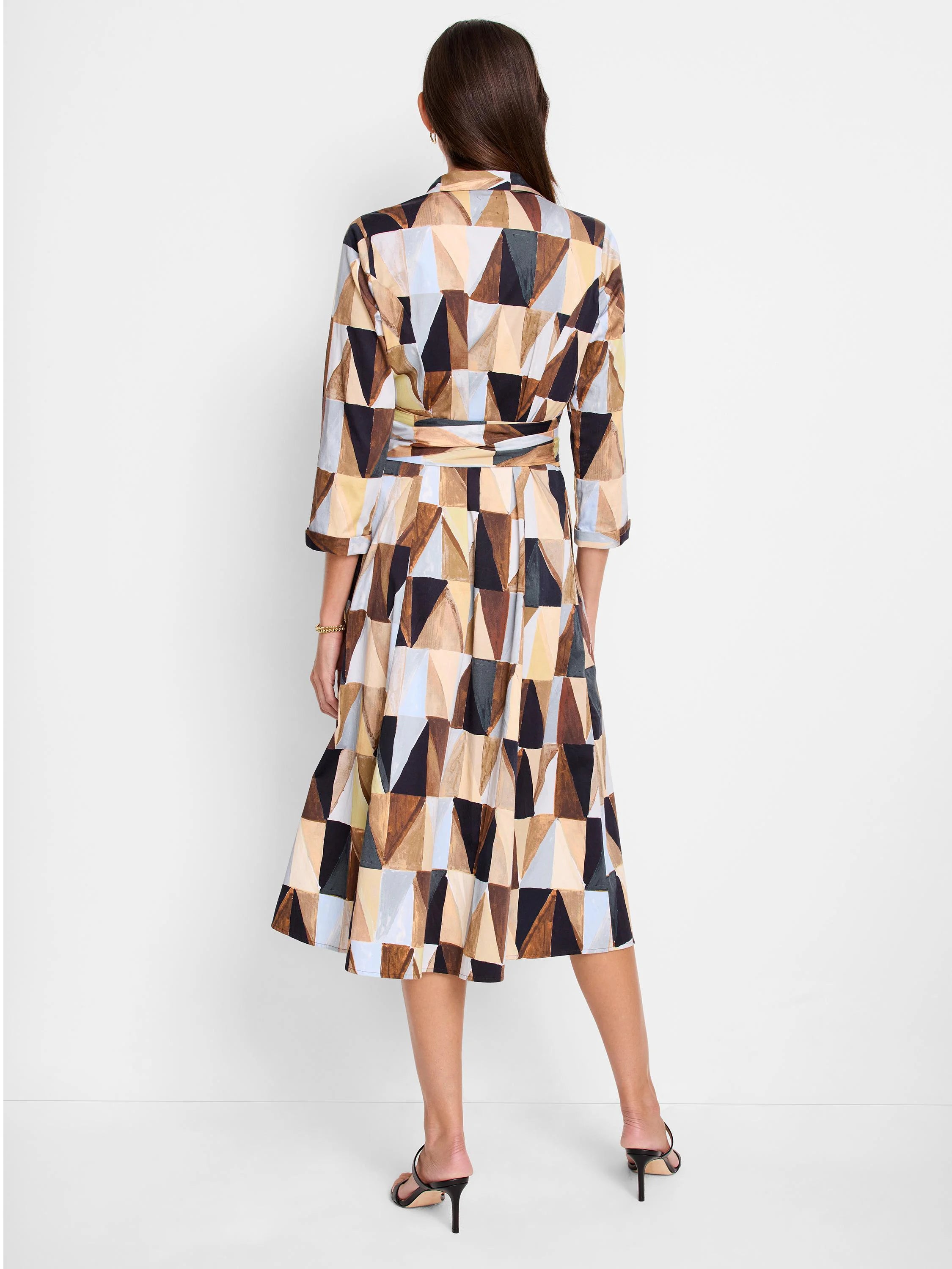 A-line midi shirt dress in brown, beige, and light blue geometric print. Three-quarter sleeves, belted waist.