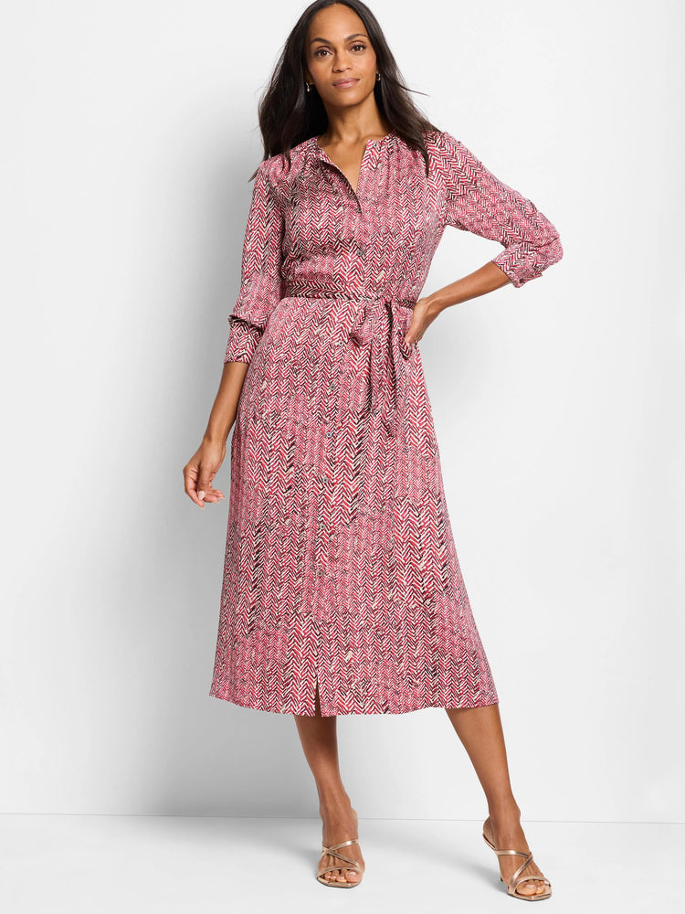 Red midi dress with a herringbone pattern in black and cream. Three-quarter sleeves, belted waist, and a center front slit.