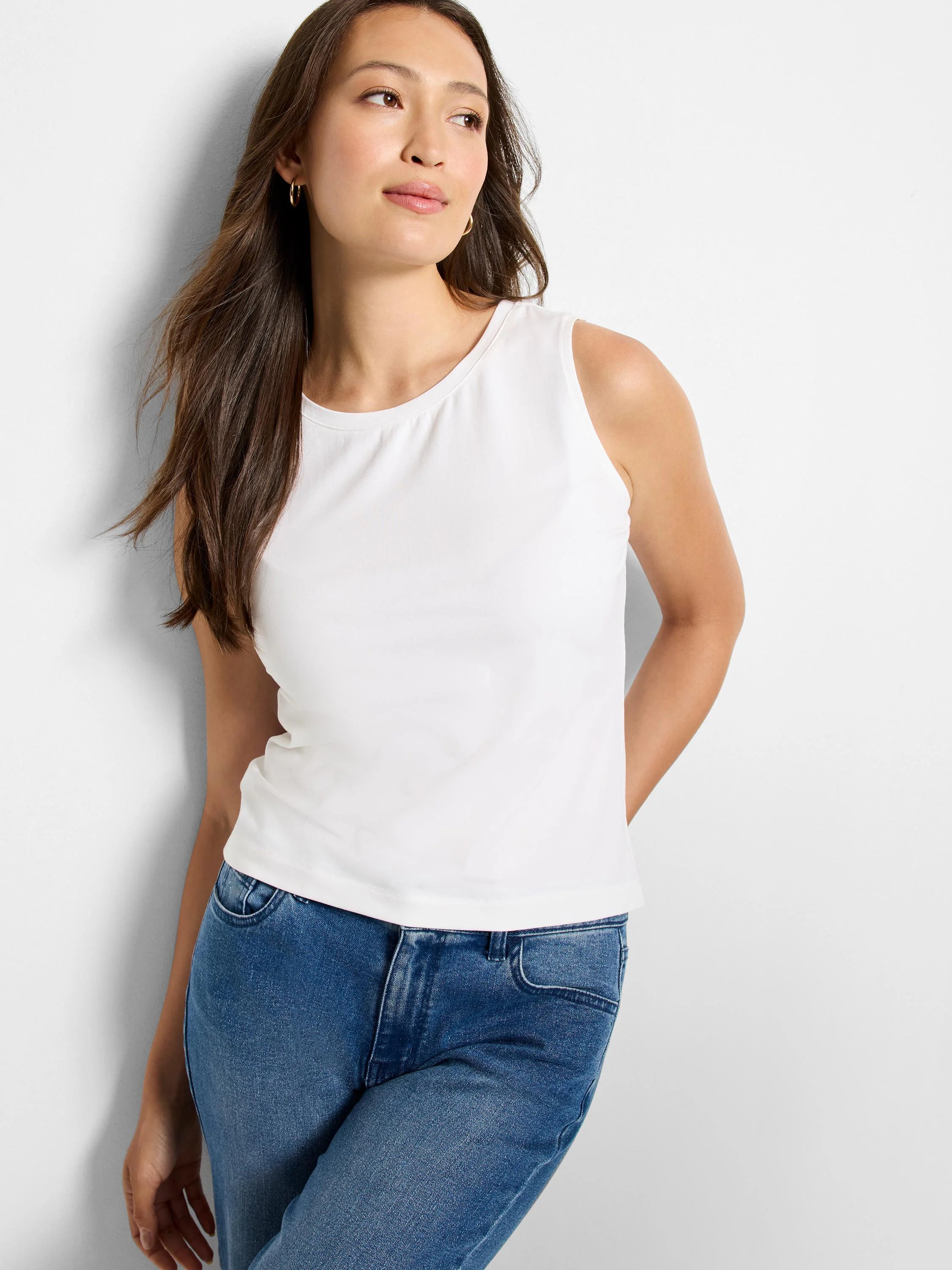 White, smooth knit, sleeveless tank top with a round neck.
