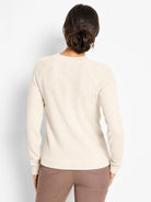 Cream thermal waffle knit top with long raglan sleeves. Back view.