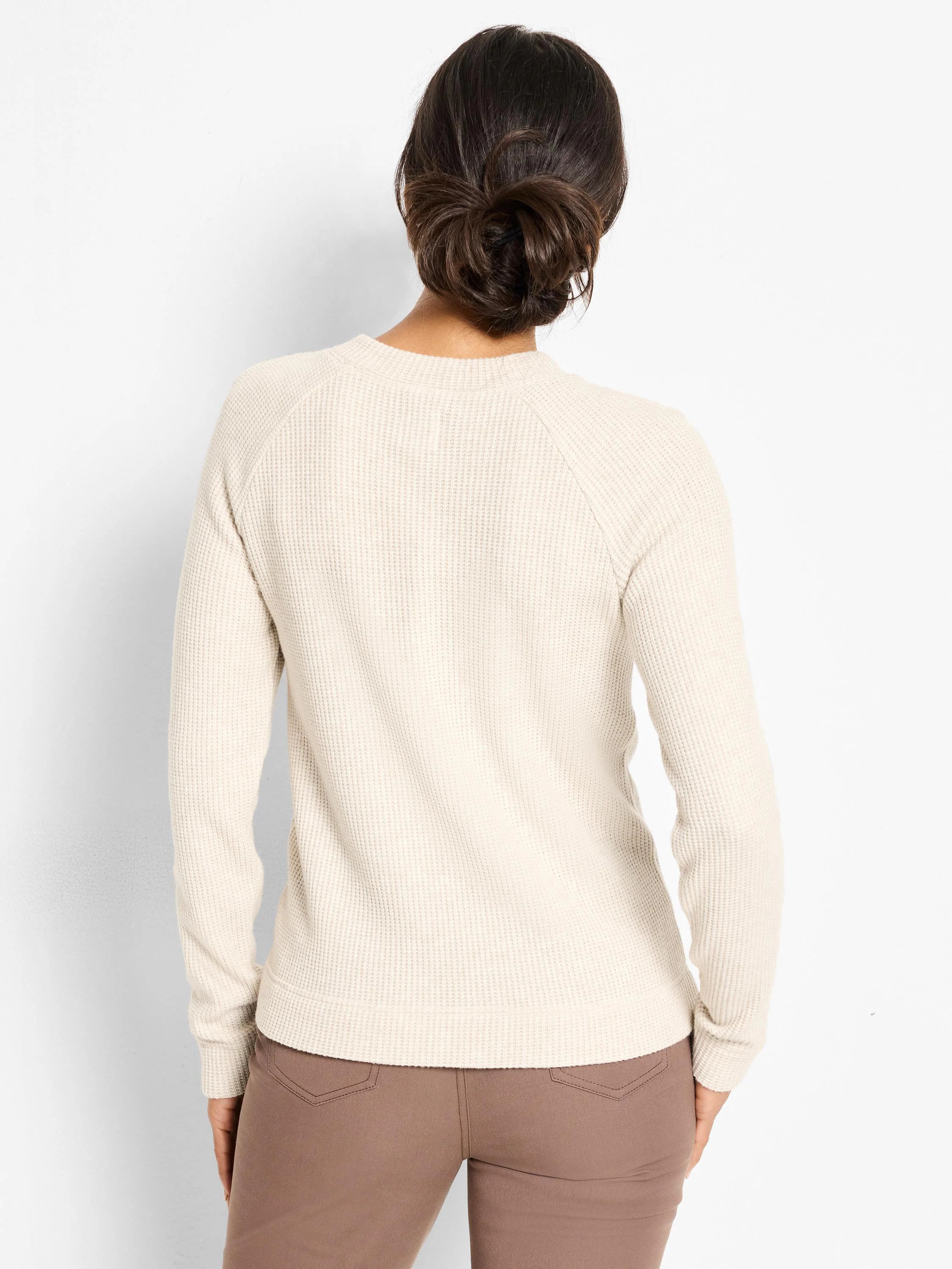 Cream thermal waffle knit top with long raglan sleeves. Back view.