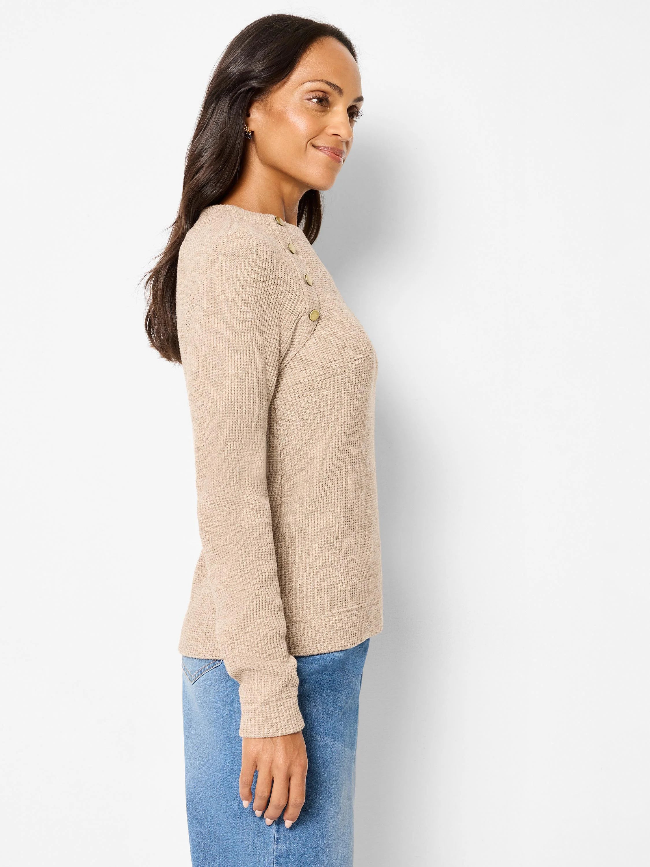 Tan waffle knit thermal top with long sleeves, featuring gold buttons along one shoulder.