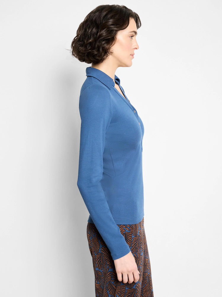 Blue long-sleeved ribbed knit polo shirt with collar and partial button placket.