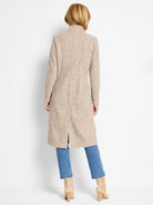 Light beige, textured sherpa tweed knit topcoat with a stand-up collar and small back slit.