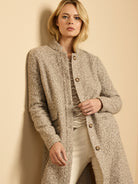 Collarless oatmeal heathered sherpa tweed knit topcoat with dark brown buttons.