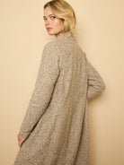 Long greige topcoat, textured sherpa tweed knit fabric with a nubbly surface.