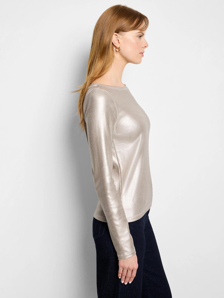 Shimmery golden, ribbed, long-sleeve boat neck tee on a model.