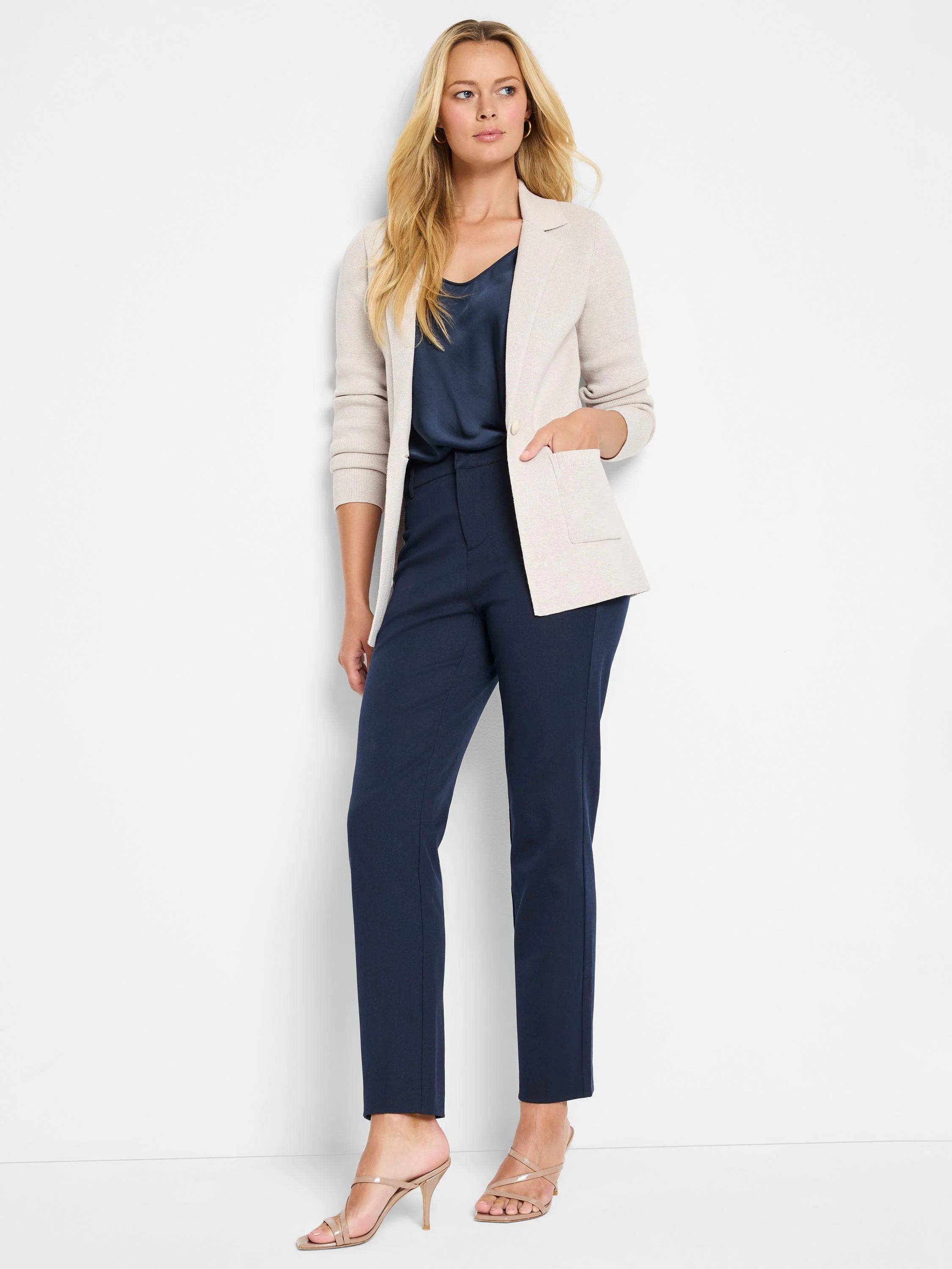 Light beige knit blazer with notched lapels and front patch pockets, shown worn open.