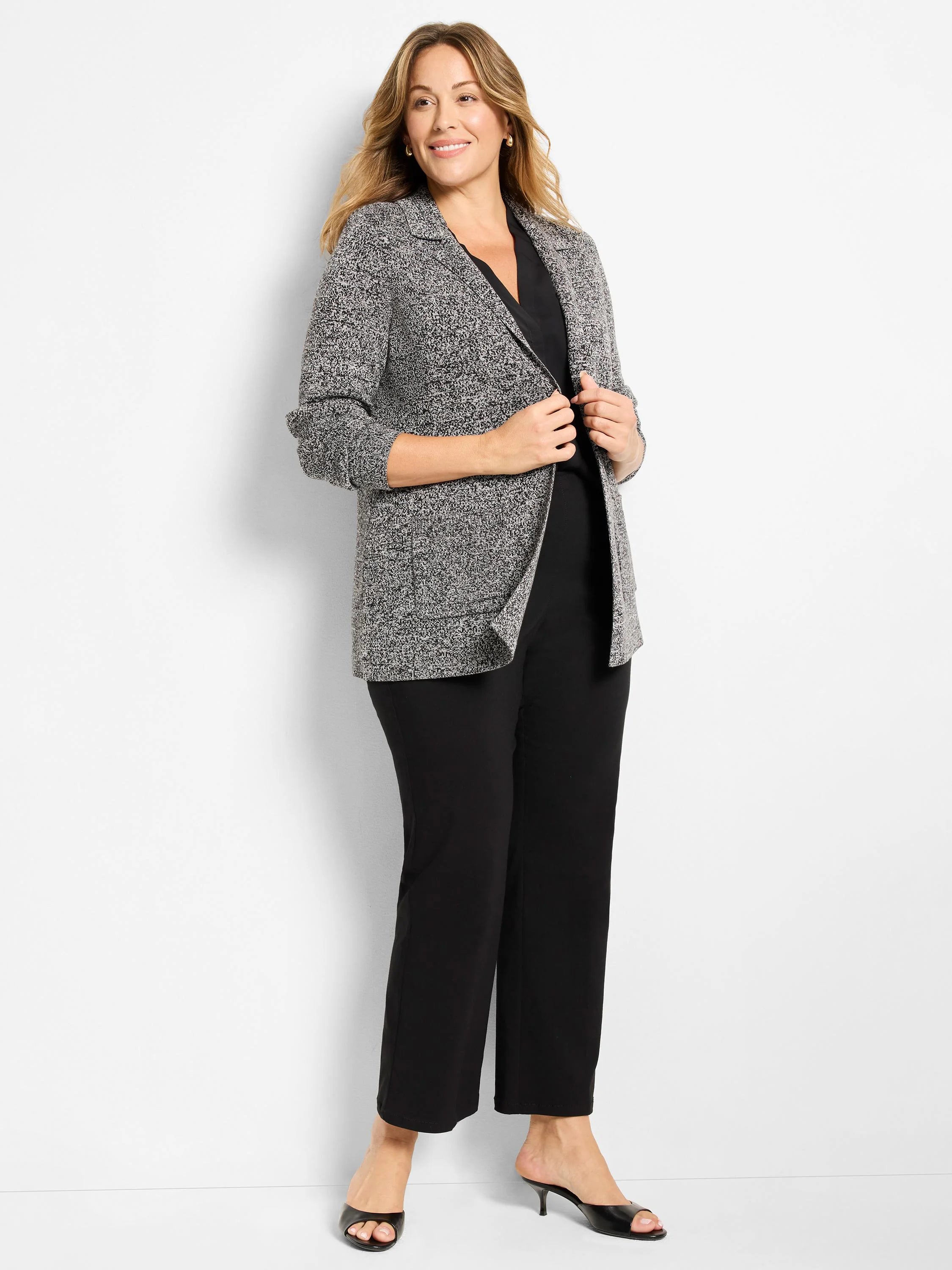 Mélange gray knit blazer with white flecks, open front design, and notched lapels.