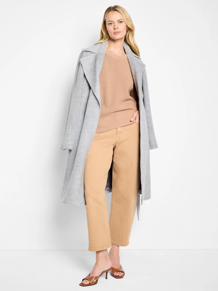 Tan crew neck sweater with distinct shaker stitch ribbing.