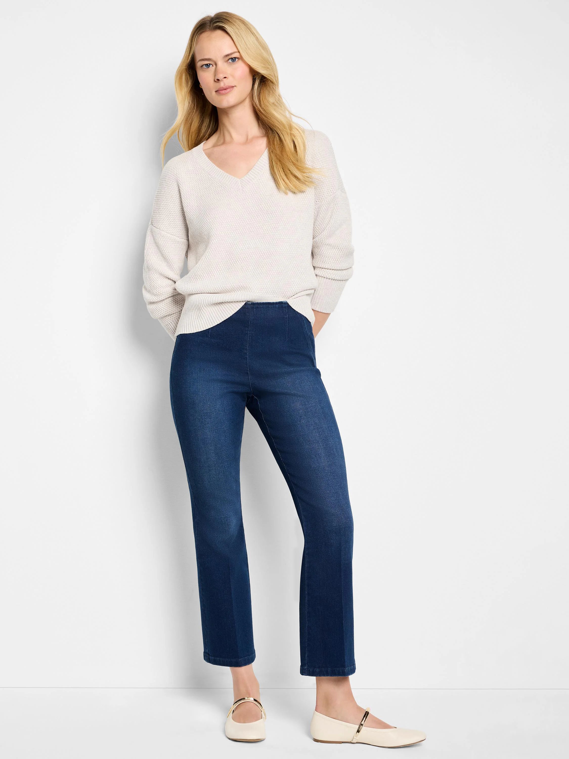 Oatmeal V-neck sweater featuring a distinct tuck stitch knit texture.