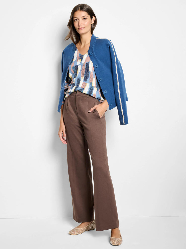 V-neck sweater with abstract brushstroke pattern in blues, white, yellow, and pink.