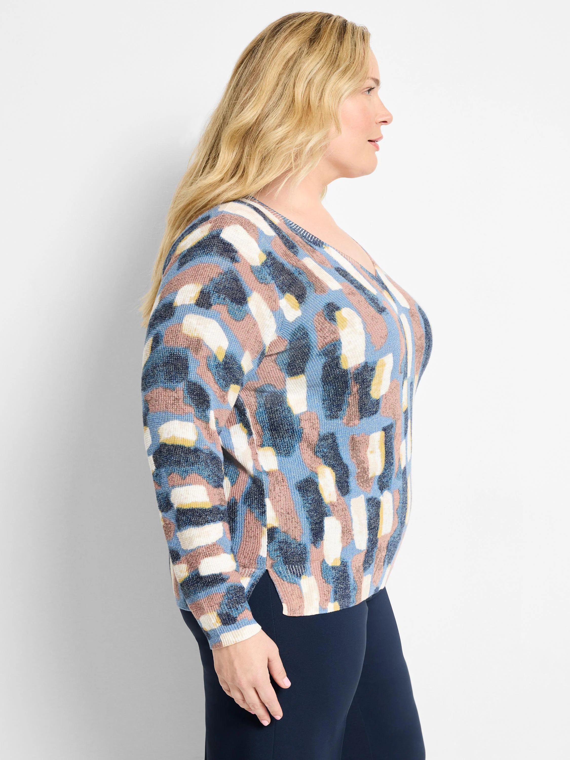 Waffle V-neck sweater with brushstroke pattern in blues, dusty rose, cream, and yellow.