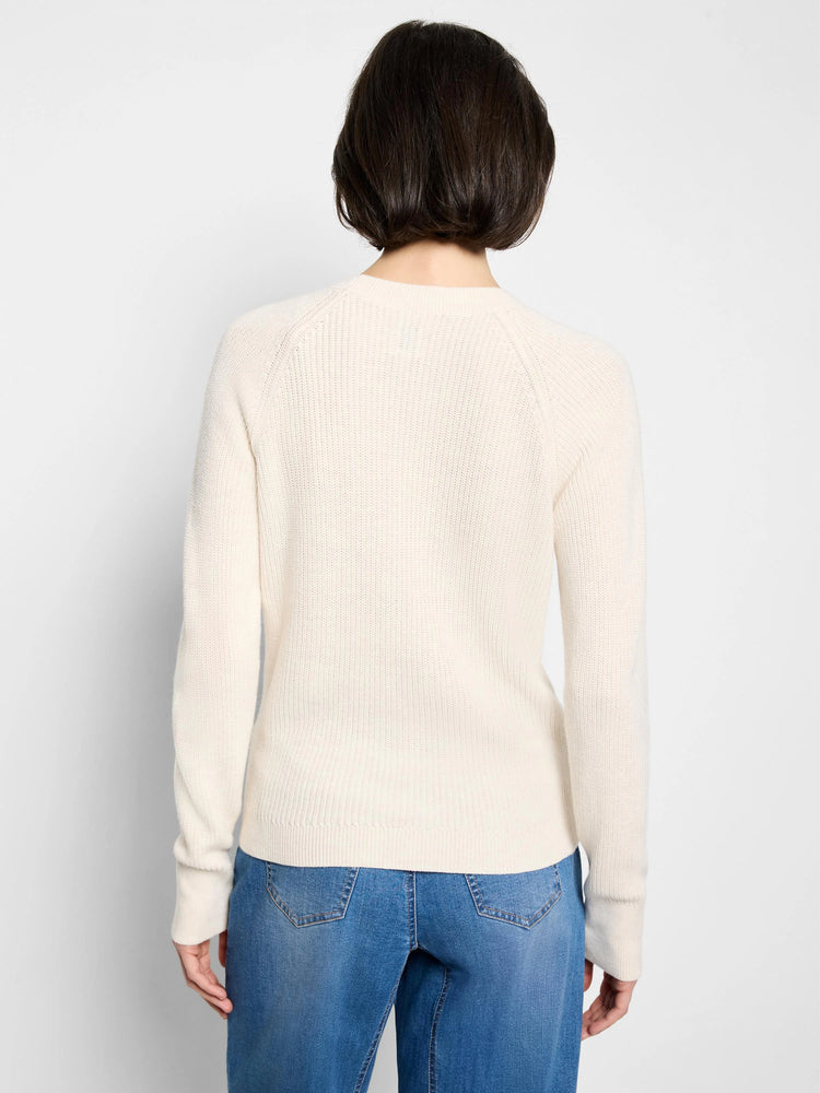 Ecru shaker knit sweater, back view. Raglan long sleeves and ribbed texture.