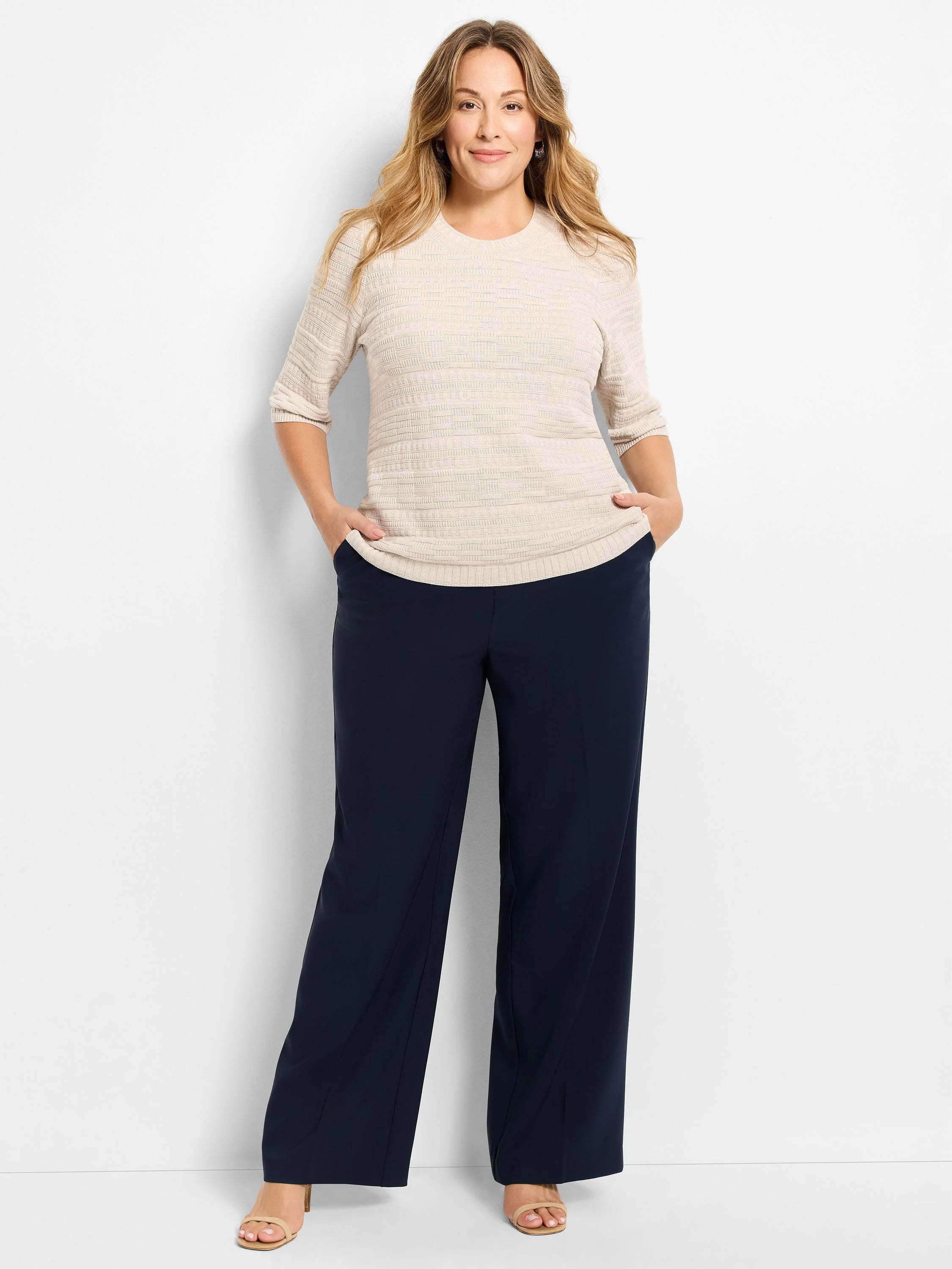 Ecru sweater tee with round neck and 3/4 sleeves, featuring a distinct horizontal and vertical knit texture.