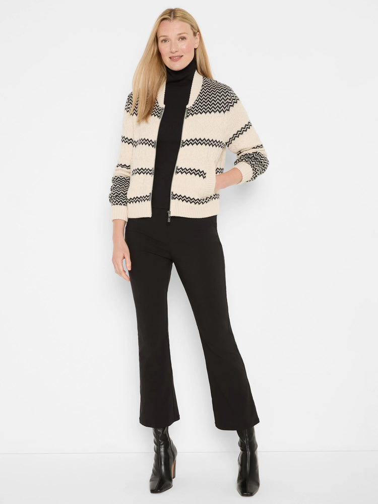 Cream bomber jacket with black zig-zag stripes, full zipper, and ribbed trim.