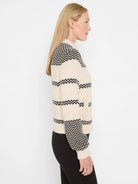 Off-white & black zig-zag knit bomber jacket. Features black zig-zag bands & denser patterns on shoulders/cuffs. Side...