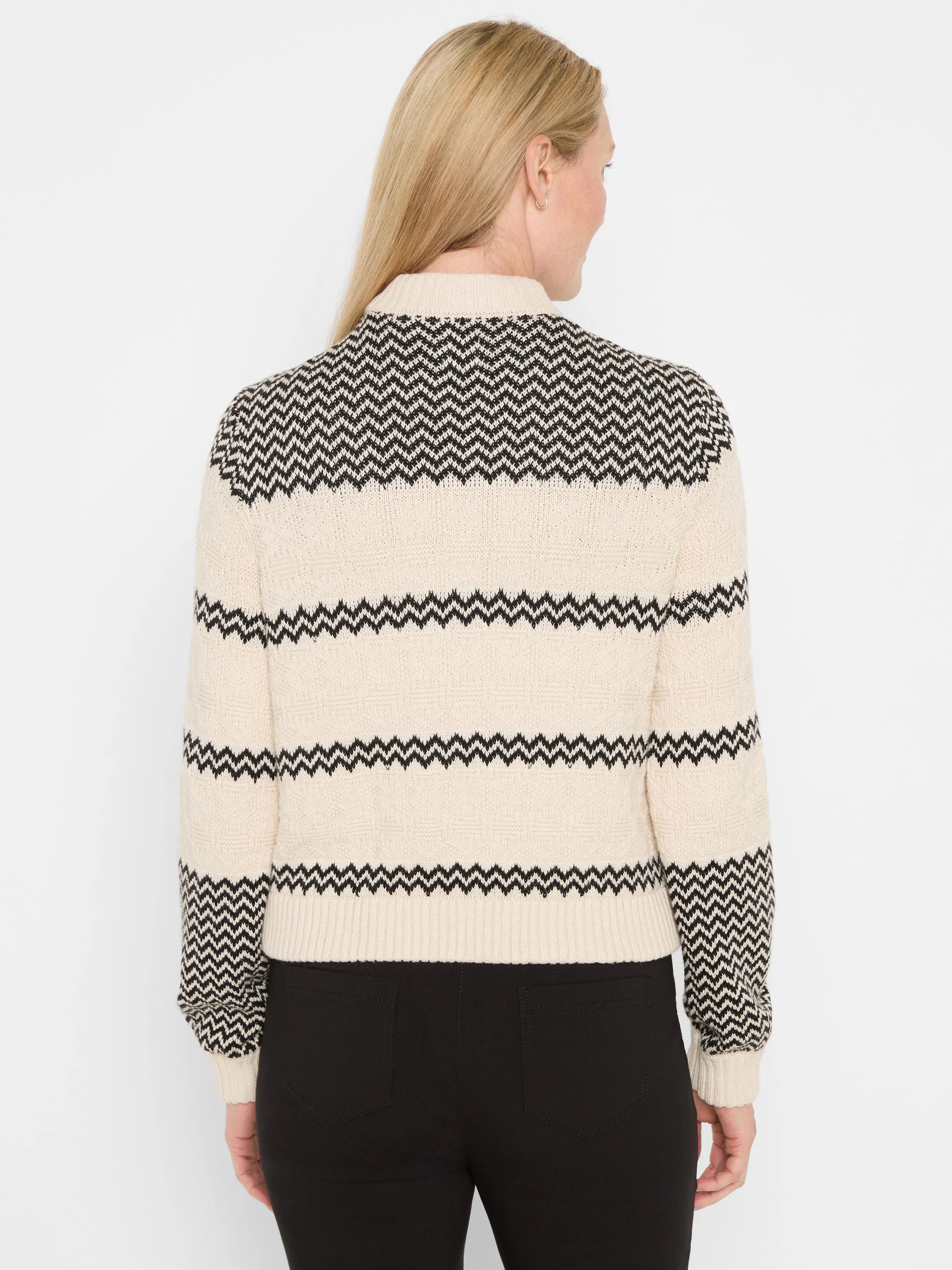 Cream and black knit bomber jacket with zig-zag pattern, seen from the back. Ribbed cuffs and hem.