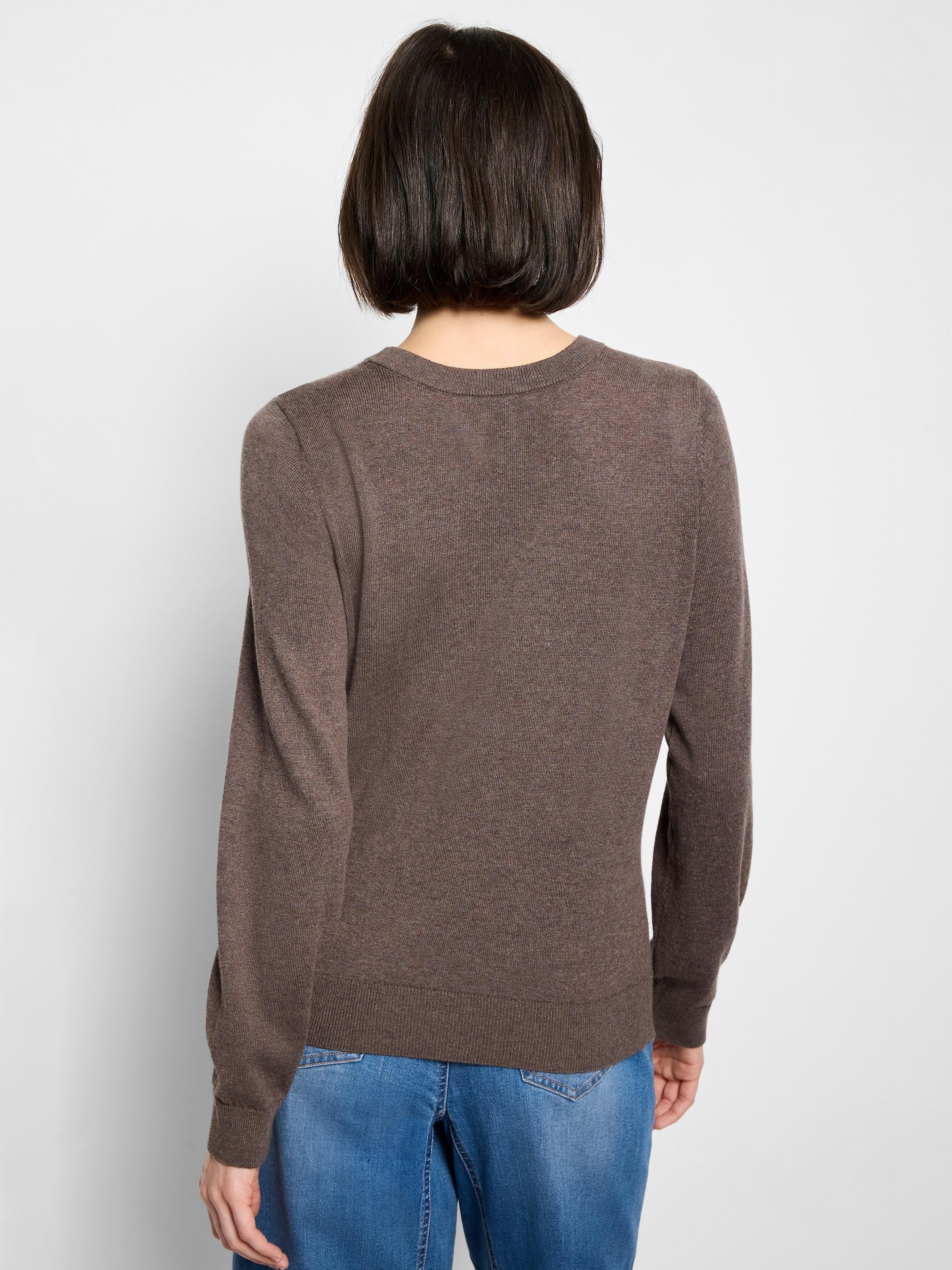 Mottled brown crew neck sweater, back view on model. Fine knit with ribbed collar, cuffs, and hem.