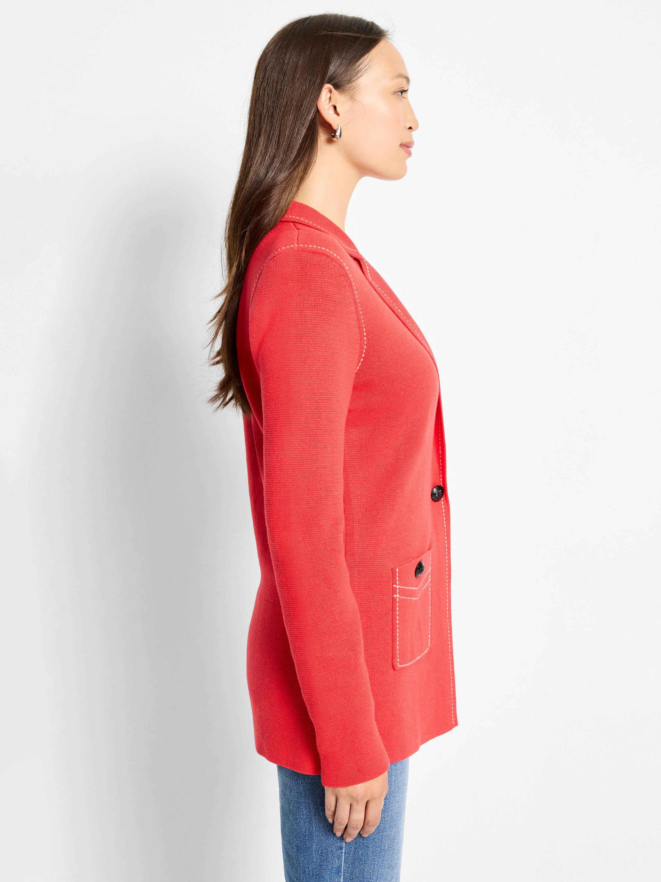 Red knit blazer with white contrast stitching on lapels, shoulders, & pockets. Features dark buttons.