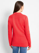 Red knit blazer with white contrast stitching along the collar and shoulder seams, shown from the back.