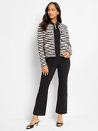 Black and off-white horizontal striped knit jacket with fringe details.