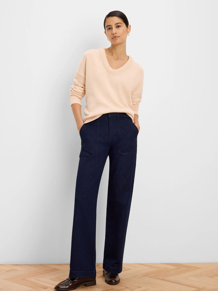 Light peach knit sweater with a relaxed fit and scoop neck.