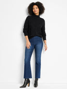 Black high-neck sweater featuring a subtle diamond texture.