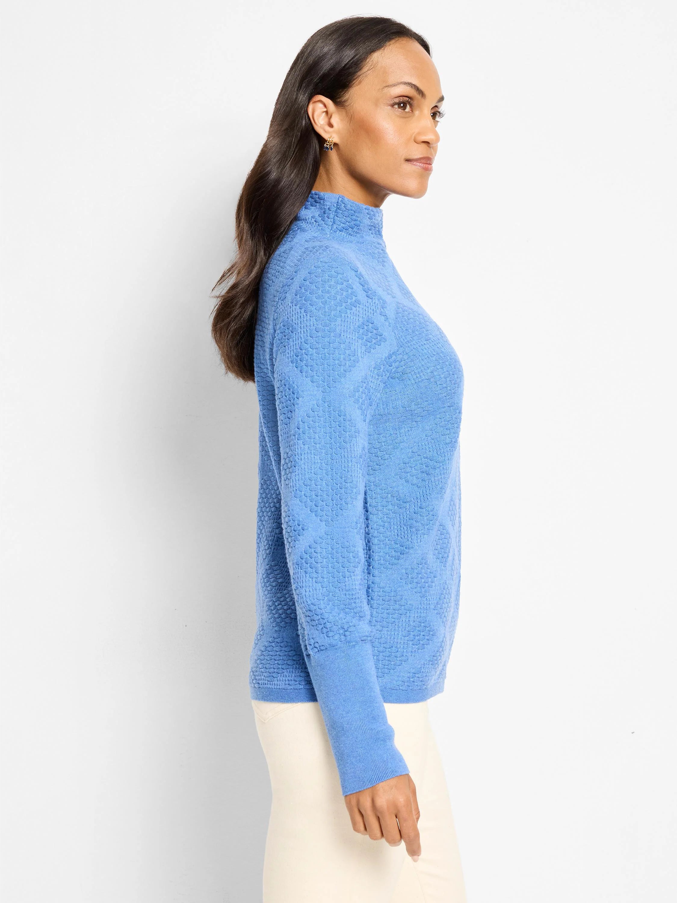 Blue mock neck sweater with an all-over raised diamond texture.