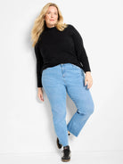 Black mock neck sweater with a subtle, raised diamond-shaped texture.