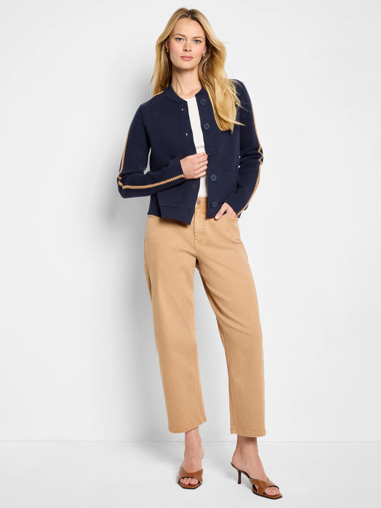 Navy knit bomber jacket with round neck, button front, and tan zig-zag stitching detail on shoulders and sleeves.