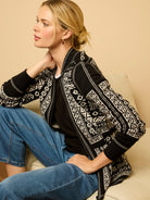 Black & white Nordic-patterned reversible jacket with full zip and ribbed cuffs.